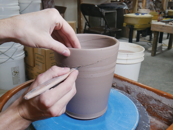 2 Cut the top off the jar body, leaving it with an angled rim.