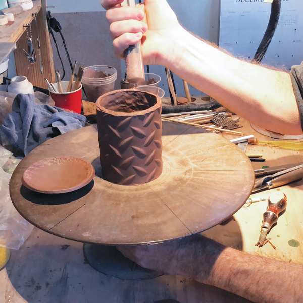 8 Using thick slip, attach the base to the mug body.