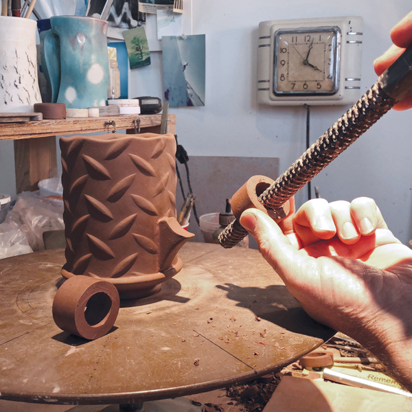 11 Use a tubular rasp to size the inner diameter of handle rings.