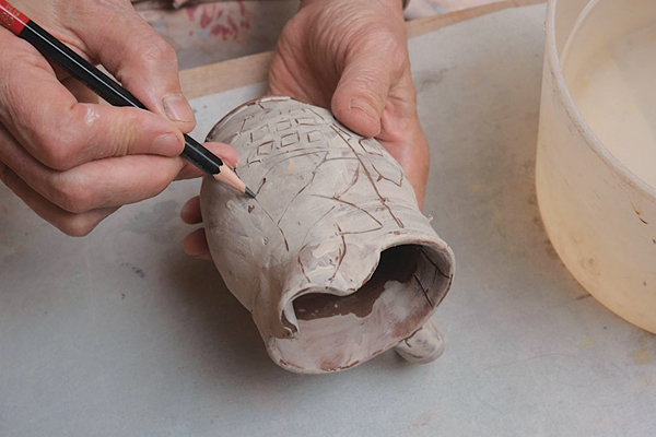 13 Sketch the decoration on paper. I loosely divide the surface into sections, then transfer the design freehand.