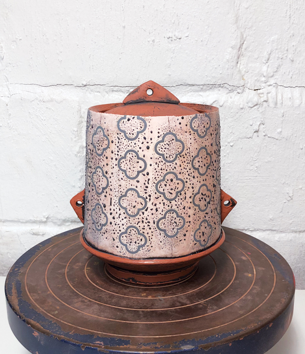 13 Apply wax to the entire pot, then remove the vinyl. Brush on layers of underglaze.