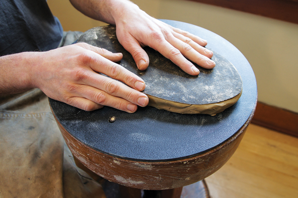 1 Use a tar-paper template to cut and form the base of the bowl out of a 1/2-inch-thick slab.