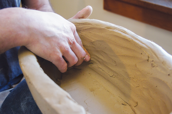 6 Compress and blend the coils until the walls are smooth and a consistent thickness.