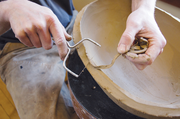 8 As the walls are stretched, clean up any rough edges using a cheese cutter, wire tool, or rasp.