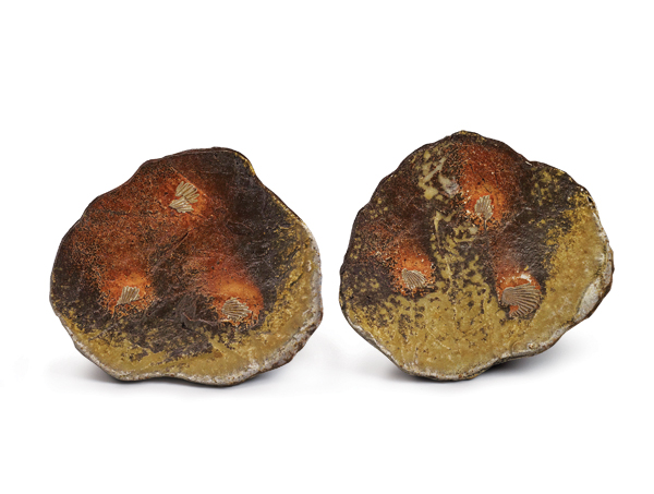 15 Meg Beaudoin’s sushi plate pair, 8 in. (20 cm) in length (each), handbuilt stoneware, Cedar Heights Redart slip, natural ash glaze, sea shells, wood fired in an anagama for 5 days to cone 12, 2018. Photo: Robert Sturm, Storm Photo, Kingston, New York. 