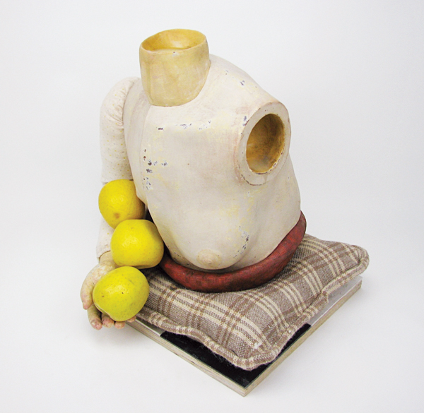 3 Kourtney Stone's My Earliest Memories III, 18 in. (45 cm) in height, earthenware, underglaze, found objects, apples, textiles, wax, 2019. 