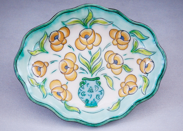 5 Jim Smith’s small dish with vase and flowers, Nova Scotia earthenware, fired to cone 04. 