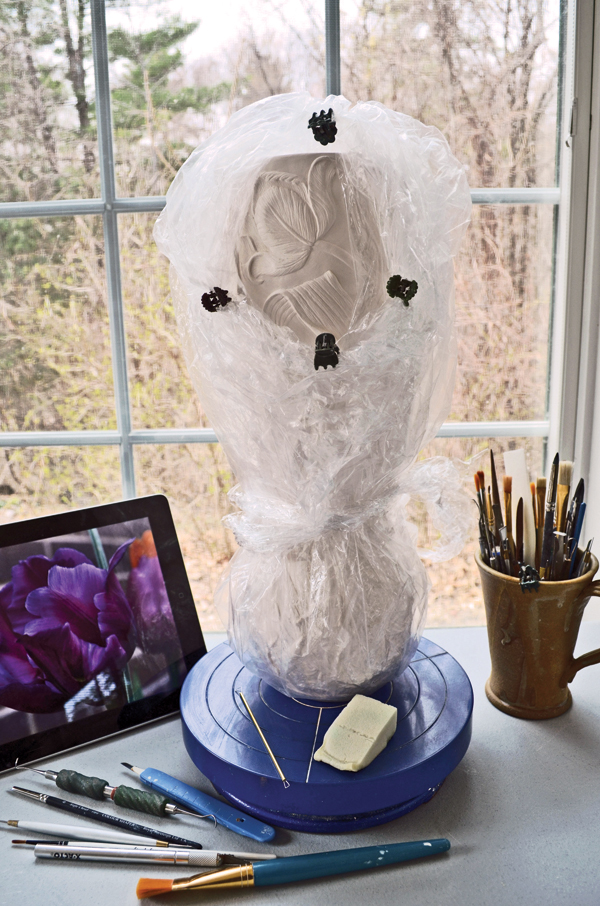 3 Create a window in the plastic covering for carving small areas.