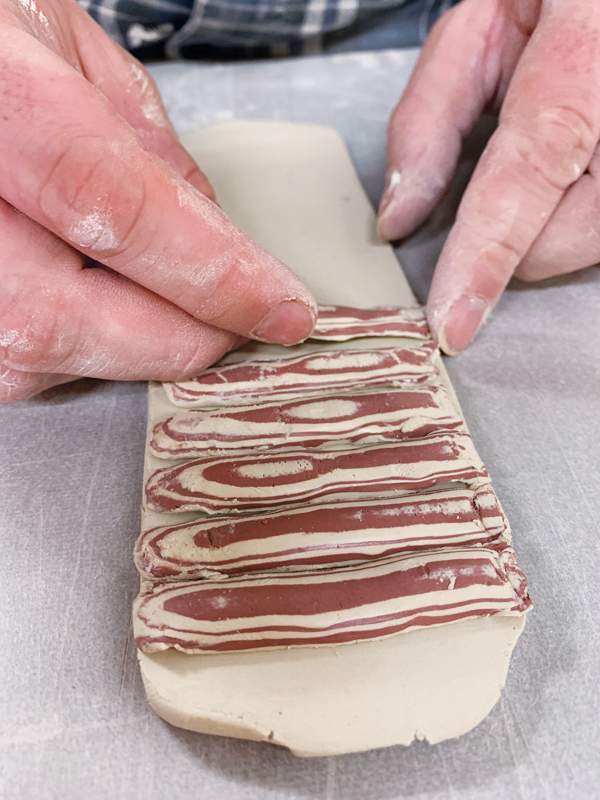 6 Place the trimmings evenly along the rolled slab.