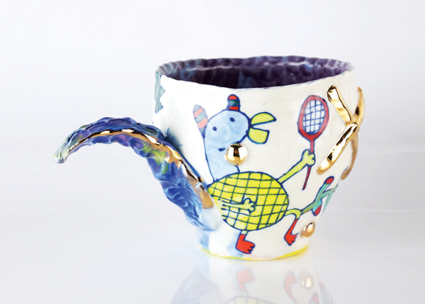 1 Chanakarn Semachai’s Dino Jungle Mug, winner of the artists’ choice award, porcelain, underglazes, fired to cone 6 in oxidation, luster. 