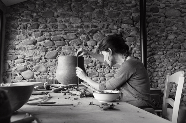 5 Adding a vertical coil to the side of the pot to create a raised spine.