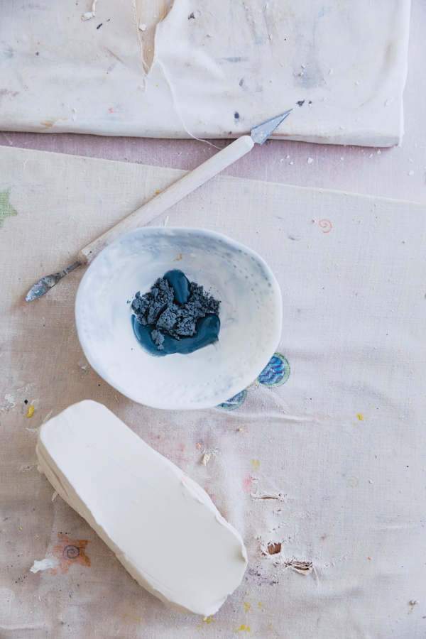3 Add water to a ceramic stain to form a paste before mixing it into porcelain slip.