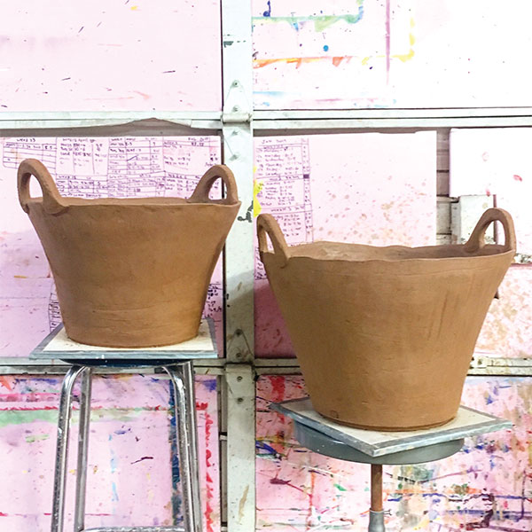 12 Compress the rim and create texture over the entire bucket by scraping it with a metal rib to bring the grog to the surface.