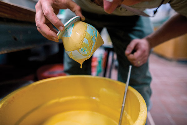 14 Use the foot ring to glaze the exterior of the cup. All process photos: Paul Gandy.