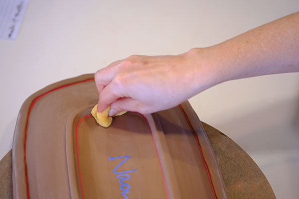 18 Use a damp sponge to remove excess underglaze and reveal a pop of color. 