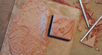 3 Carve multiple stamps from leather-hard clay, allow them to dry, and bisque fire them.