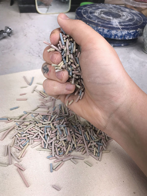 2 Crunch up the dried extruded coils into sprinkle-sized pieces.