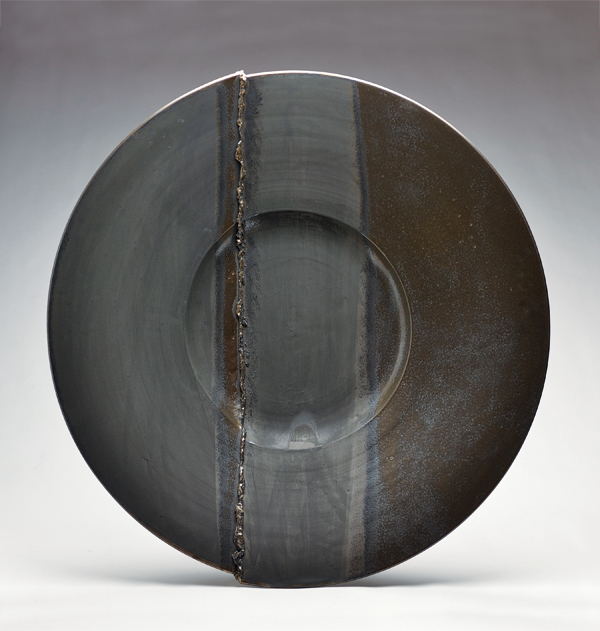 7 Wall platter, 24 in. (61 cm) in diameter, wheel-thrown stoneware, cut and reassembled, oxides, metallic glaze, fired to cone 6 in an electric kiln. 