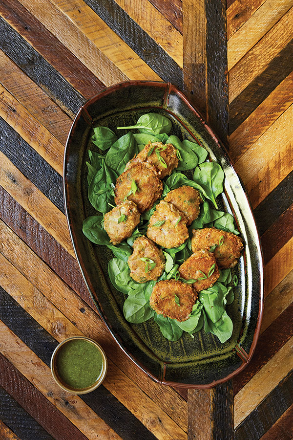 1 Tiffany Hilton’s platter, 18 in. (46 cm) in length, handbuilt stoneware, teadust glaze, gas fired to cone 10 in reduction, 2018. Photographed for the fall 2019 issue of Edible Pioneer Valley by Dominic Perri, featuring Mary Reilly’s bean fritters with salmoriglio sauce.