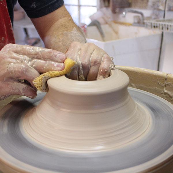 2 Start pulling in a conical shape, preventing the top from becoming too wide.