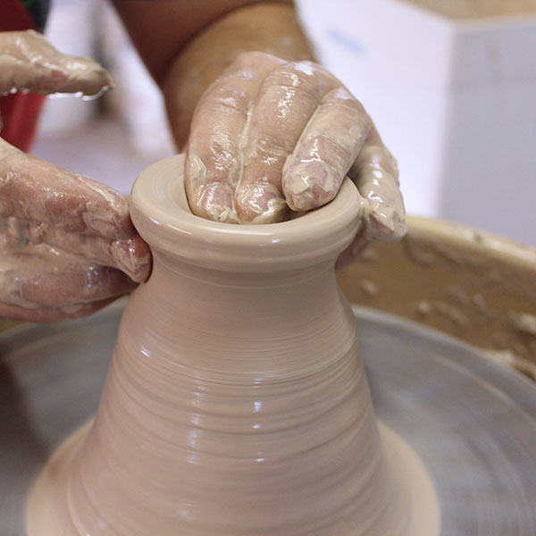 8 Make the lid off the hump by centering 2–3 pounds of clay and opening it up.