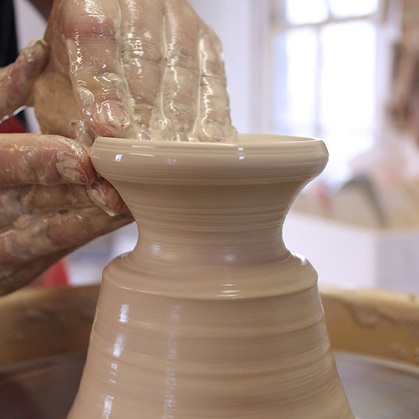 9 Press under the opened section and pull outward to create the shallow bowl lid.