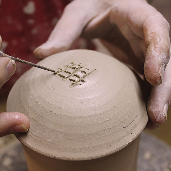 14 Score the top of the lid, then add a little water to create a slurry.