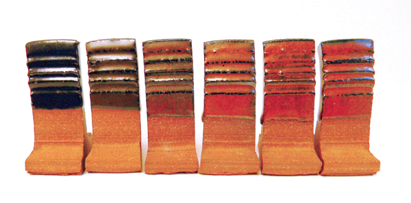 2 A transition from tenmoku to tomato red as crystallizers are added to the glaze base (fired to cone 6 in oxidation on Standard 308 clay body).