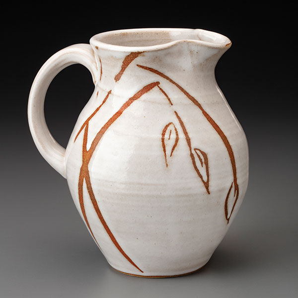 5 Pitcher, 9 in. (23 cm) in height, stoneware, wax resist, glaze, fired to cone 8 in oxidation, 2019.