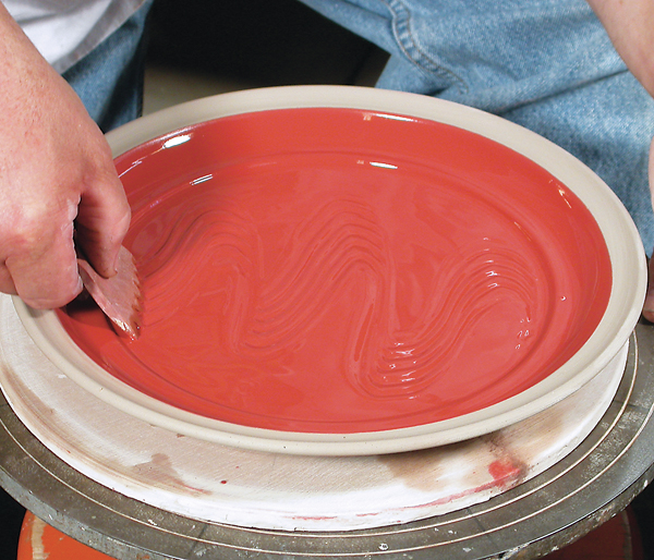 8 Combing through a single-colored, fluid slip to create a surface pattern.