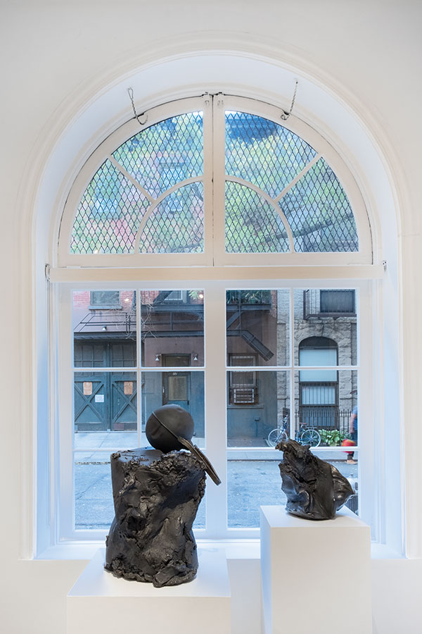 6 Left: Ball and Reclaim, 29 in. (74 cm) in height, black stoneware, 2019. Right: Torn Time, 16 in. (41 cm) in height, black stoneware, 2019.