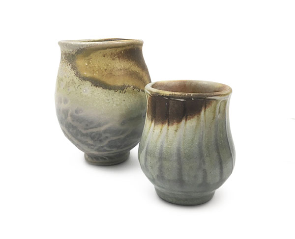 1 Harry Levenstein’s cup, 4½ in. (11 cm) in height, wood-fired porcelain, 2019; Justin Lambert’s cup, 3 in. (8 cm) in height, wood-fired porcelain, 2019. Photo: Ann Marie Cooper. 