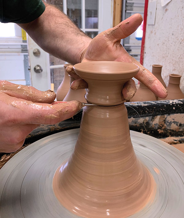 7 Use a scissor-finger grip and a needle tool to cut off and remove the spout bowl.