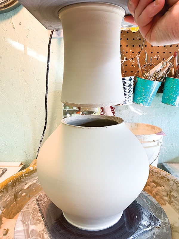 1 After throwing the two parts of the vase and allowing them to firm up, attach the neck to the belly of the vase.