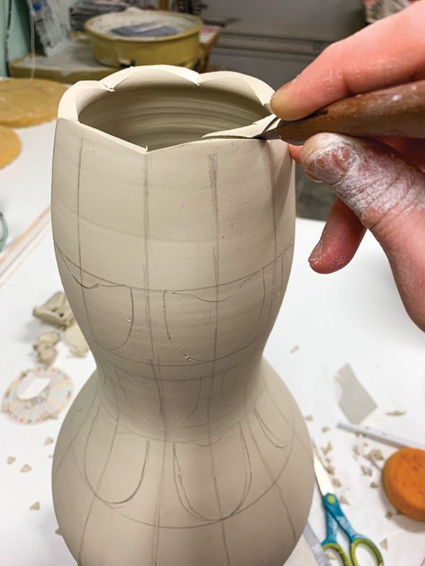 4 Scallop the lip of the vase using a sharp knife and following the graphite pencil marks.
