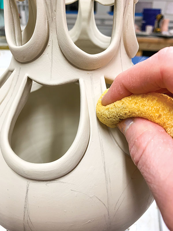 8 Clean up and smooth the newly attached coils with a clean, damp sponge.