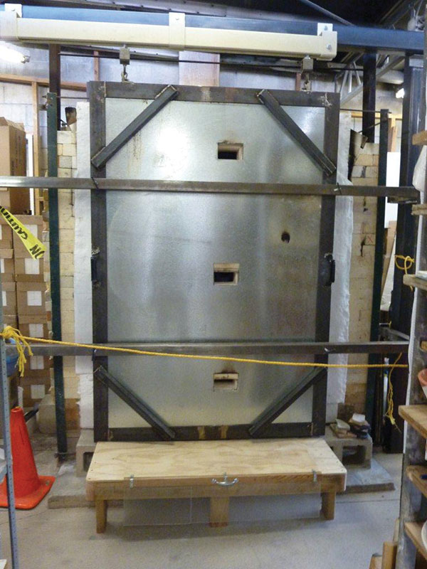 7 Finished sliding, soft-brick door on the large gas kiln. 