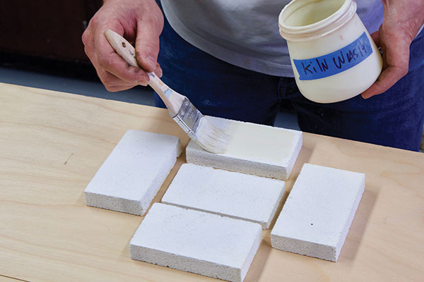 1 Apply kiln wash to the soft-brick mold pieces.