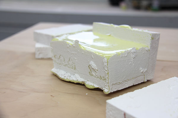 8 The fired glaze chunk with three sides of the soft-brick mold removed.