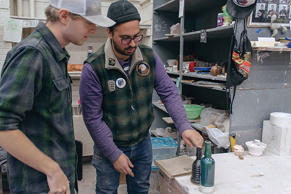 2 Miller (left) and Palmer (right) discuss the slip-cast forms’ possibilities and prototypes for collaboration.