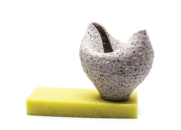 Cup with yellow glaze saucer, 6 in. (15 cm) in height, wheel-thrown porcelain, fired to cone 9 in oxidation, cast and sculpted glaze, fired to cone 03 in oxidation, 2018.