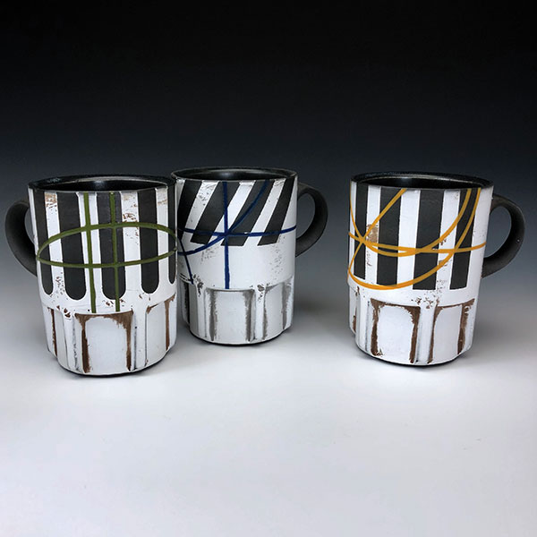 6 Eric Heerspink’s americano mugs, 4 1/4 in. (11 cm) in height, black porcelain, terra sigillata, glaze, fired to cone 5 in an electric kiln, 2019.