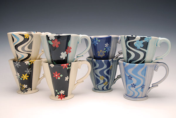 6 Deluxe Clover cups, 4 in. (10 cm) in height, wheel-thrown mid-range porcelain, hand-pulled, sculpted, and built handles, underglaze and slip-trail decoration, glaze, fired to cone 7 in oxidation, 2019.