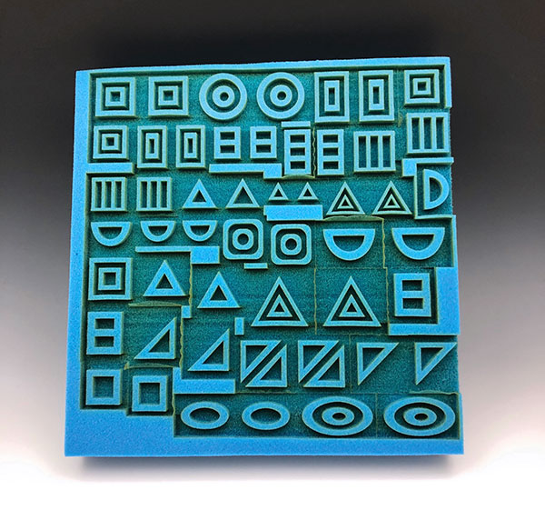 2 Laser-cut block of Aquazone sponge. This block of sponge will be cut apart into 51 individual stamps. 