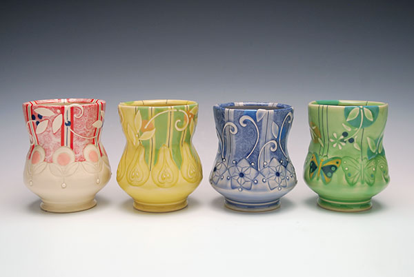 2 Yunomi, 4½ in. (11 cm) in height, wheel-thrown, stamped, and altered mid-range porcelain, underglaze, slip-sponge, slip-trail, and inlay decoration, glaze, fired to cone 7 in oxidation, 2019.