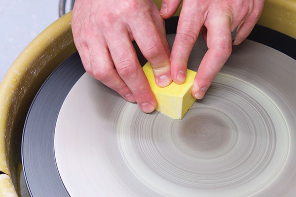 11 Polish the glaze blocks using a grinding pad attached to a potters wheel.
