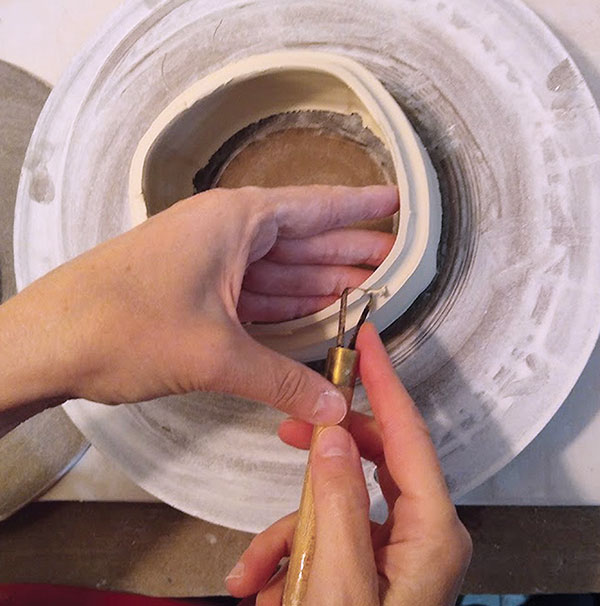 6 Trim any excess clay from the flange areas and then smooth.