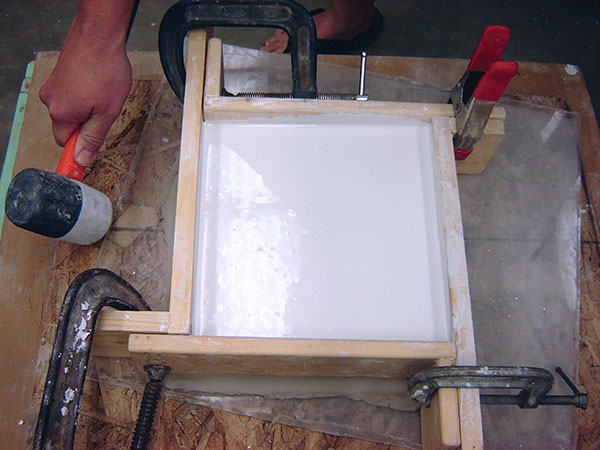 8 Pour the plaster at least 3 inches thick so the finished tile mold is sturdy.