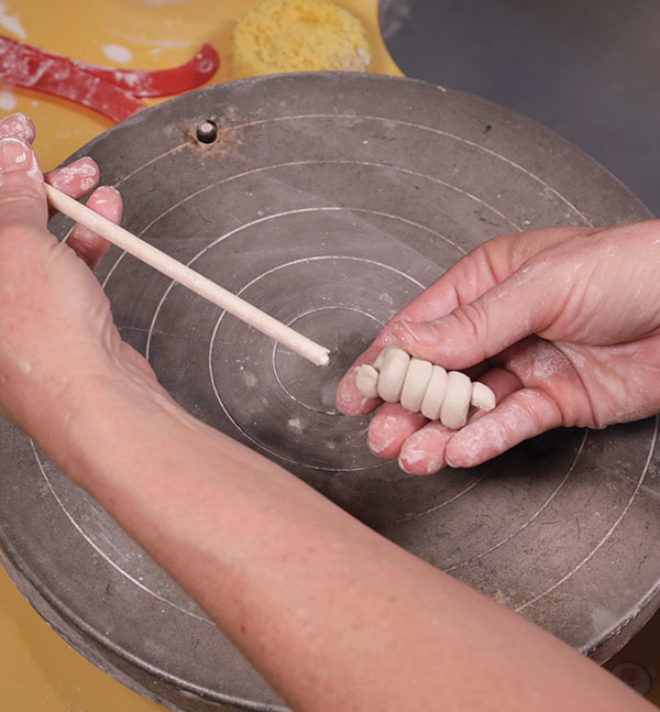 12 To make spiral handles, roll a small coil and wrap it around a thin dowel. 