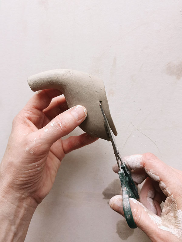 15 After a dry fit to determine the proper angles of the attachments, cut the handle and spout to fit to the teapot body.